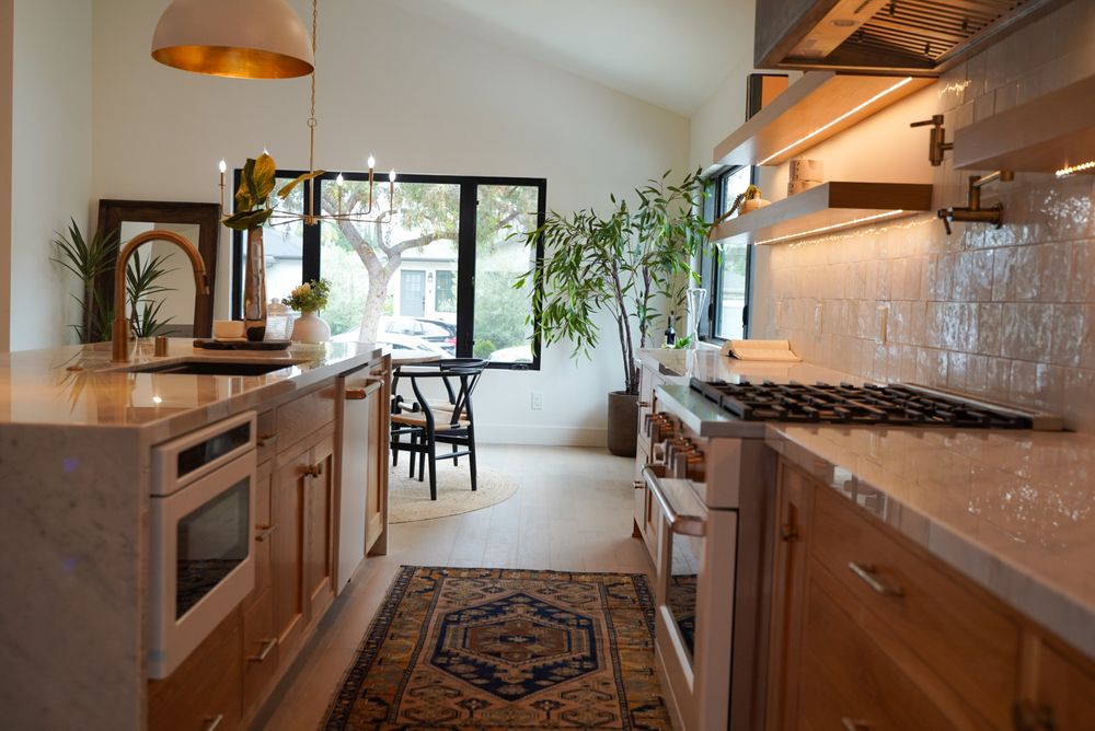 Custom walnut kitchen cabinetry with integrated appliances by Grace Kitchen Cabinets